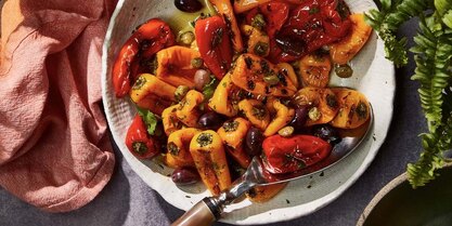 Charred sweet peppers with olives and capers in a Mediterranean-style roasted pepper salad.