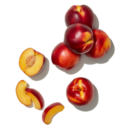 Cluster of six whole nectarines with one halved showing the pit and two slices nearby.