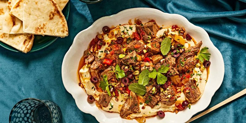 HARISSA BRAISED LAMB WITH HUMMUS