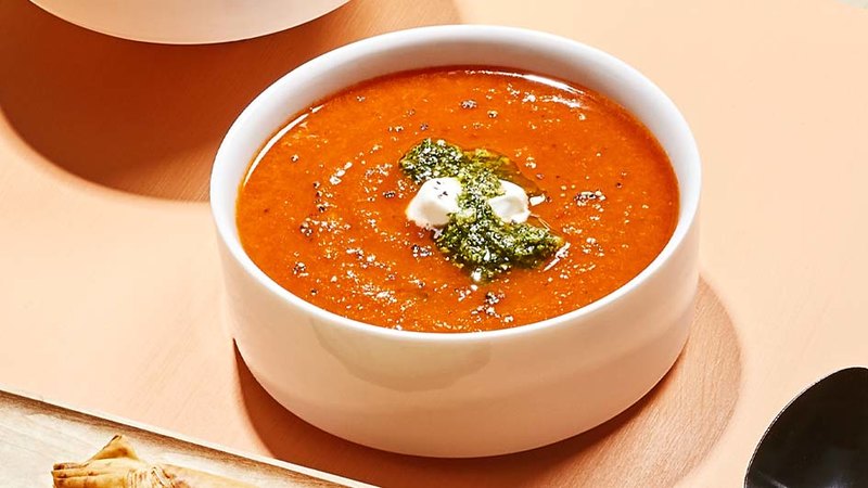 ROASTED BUTTERNUT-TOMATO BISQUE WITH CRISPY PARMESAN STRAWS