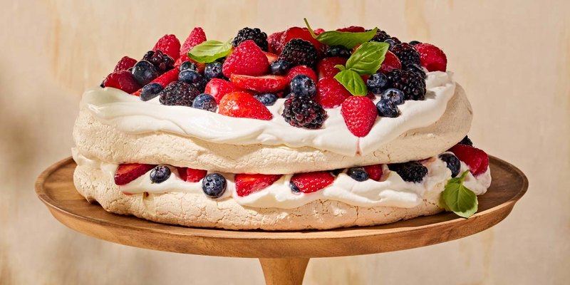 TANGY YOGOURT PAVLOVA WITH SUMMER BERRY COMPOTE